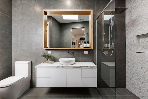 A bathroom with a mirror and sink